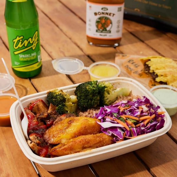 Jrk! Jamaican jerk chicken meal with plantains, broccoli, rice, and cabbage slaw, with drinks.