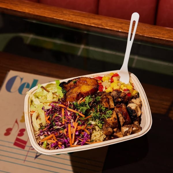 Jrk! Jamaican jerk chicken bowl with plantains, rice, and colorful slaw.