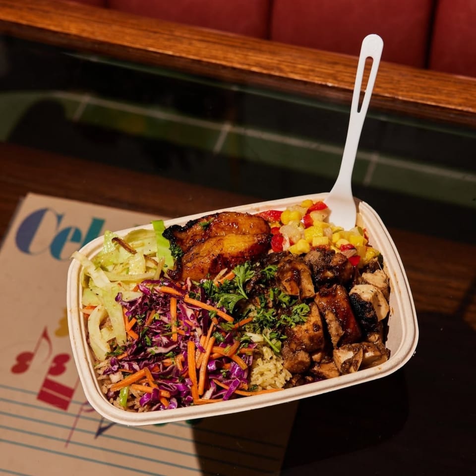 Jrk! Jamaican jerk chicken bowl with plantains, rice, and colorful slaw.